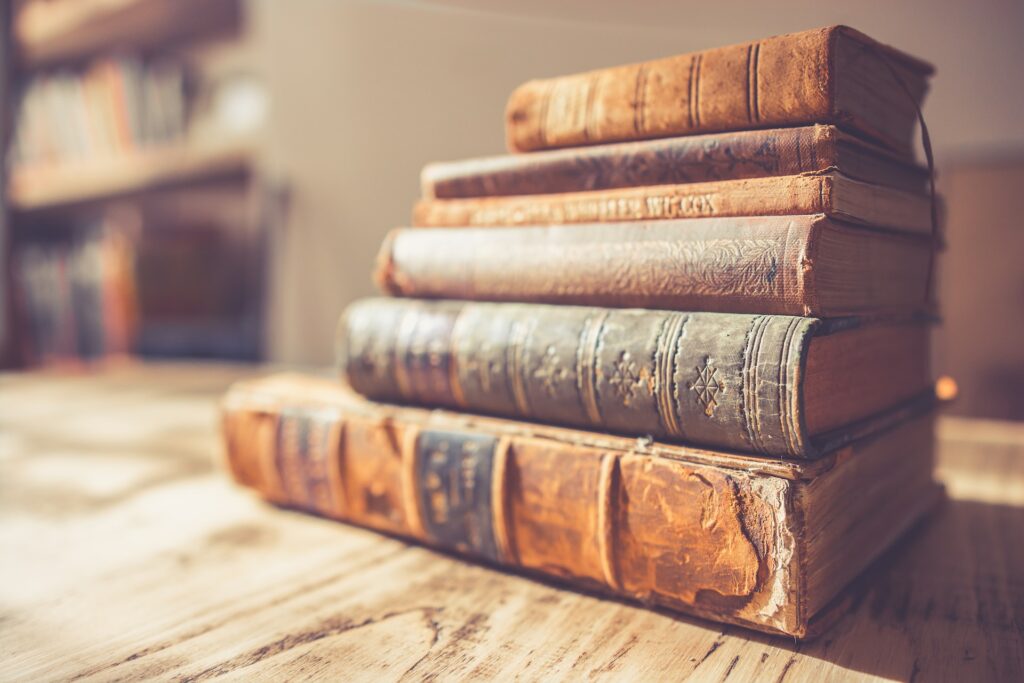 Woman with Messy Hair Reading Several Books