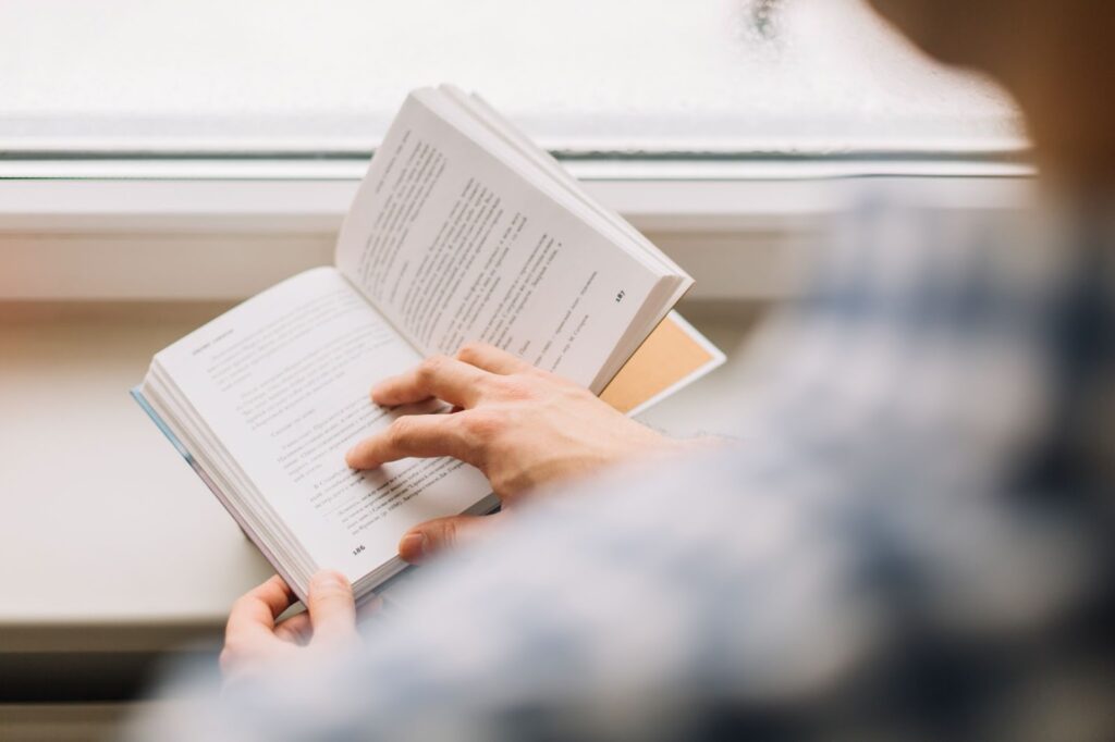 A man holding an open book