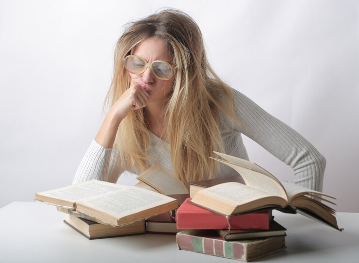 Woman with Messy Hair Reading Several Books